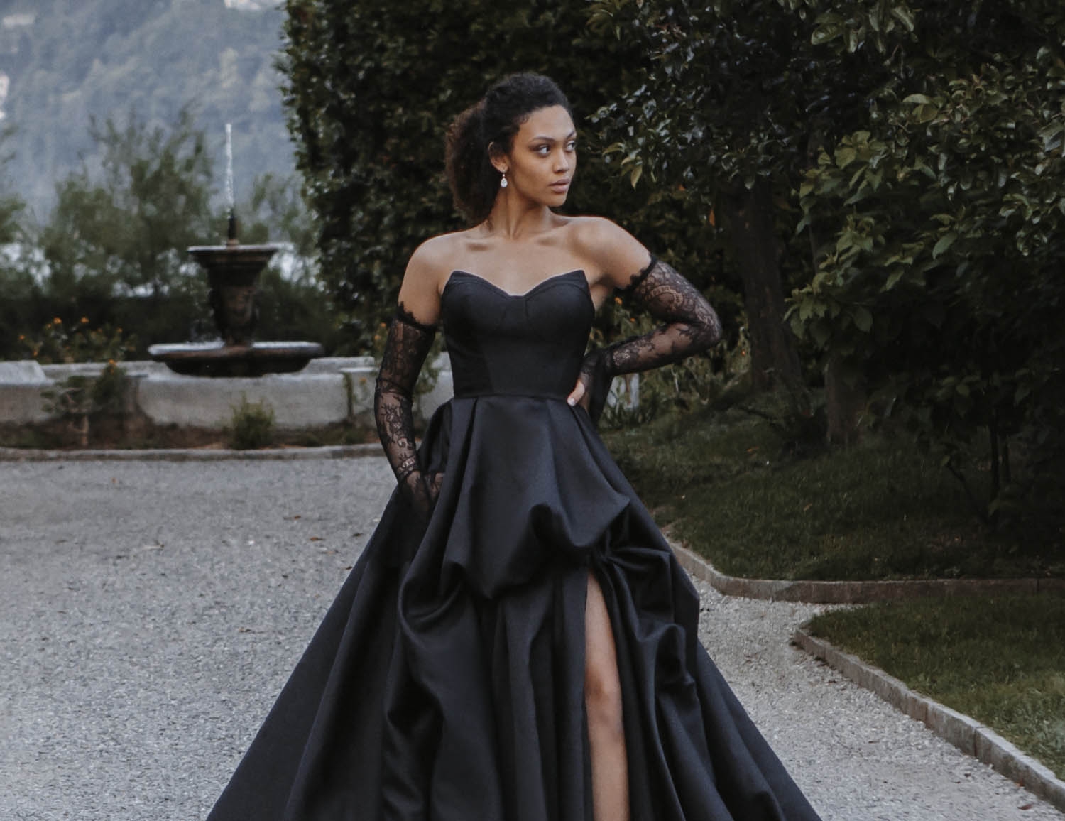 Model wearing a black gown. Mobile image